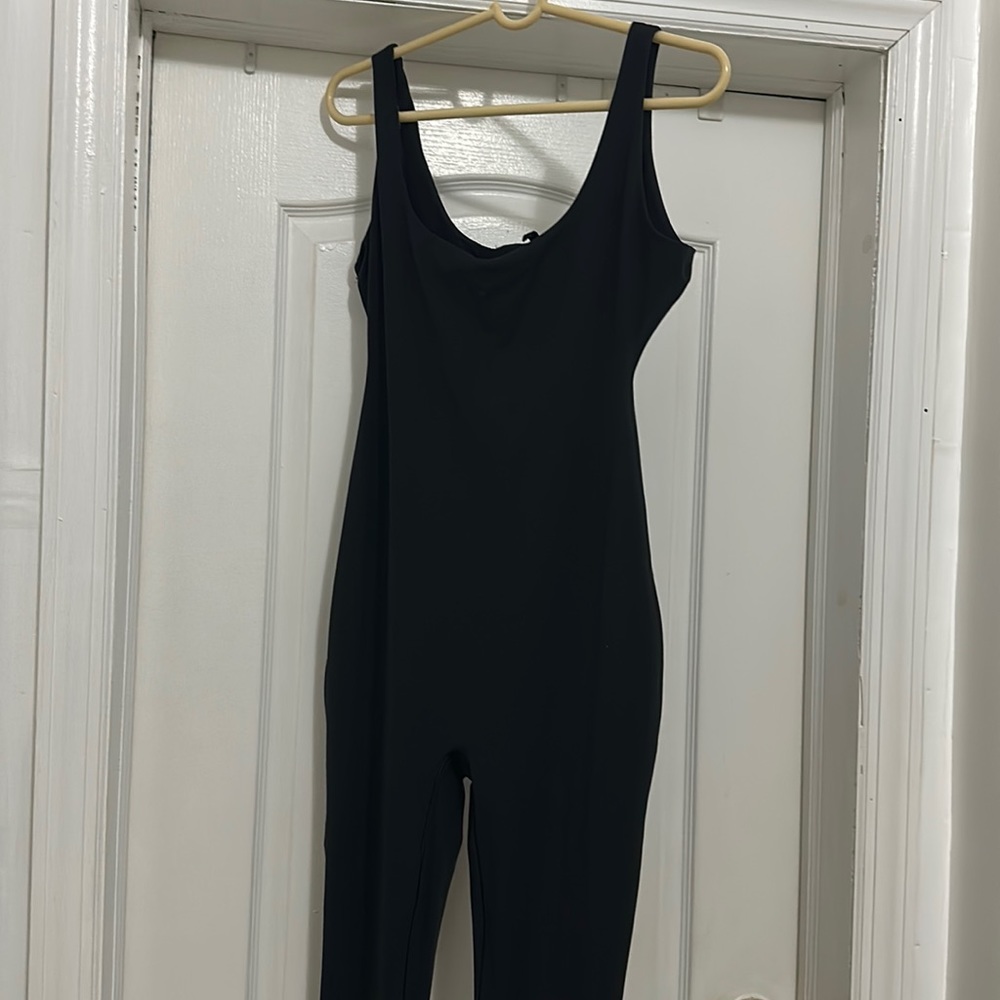 Skims black onesie.